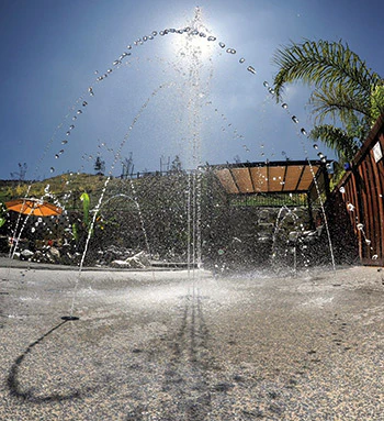 a water fountain at a splash pad park