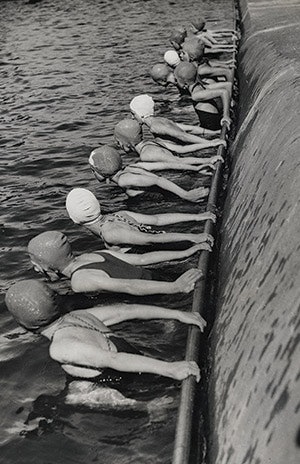 photo of swimmers lined up in swim caps