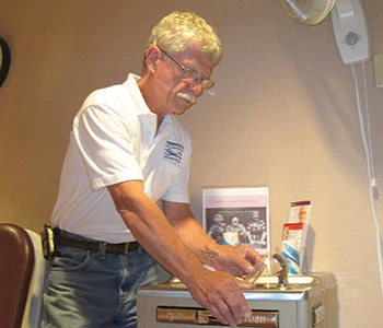 photo of Steve White testing pool water