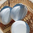 Photo of chlorine tabs in a pool skimmer basket.