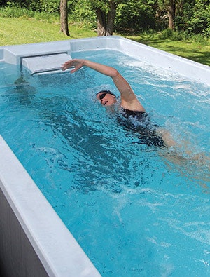 photo of a woman using a swim spa