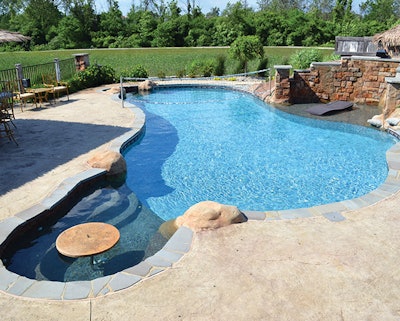 This project, in Saline, Mich., was the one that inspired me to venture into the boutique model of business. It was the first hybrid pool I ever built, and features a gunite sun ledge for lounge chairs.