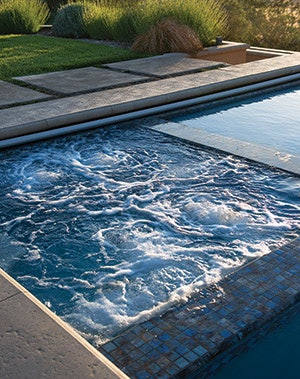 It may come as a surprise to some, but even the most lavish pool and spa designs can be created with water conservation in mind. - Click to enlarge