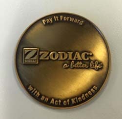 A Zodiac token distributed as part of the company's Pay-It-Forward campaign.