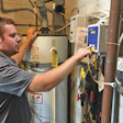 Davies changes controller settings on one of Mastercraft’s 200+ commercial swimming pools.
