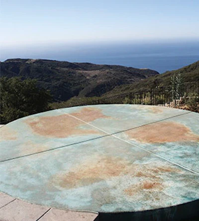 The circular yoga deck is certainly the most unusual project feature. Rendered in colored concrete, the abstract image is intended to suggest the Earth – an appropriate artistic homage to the spectacular natural setting.