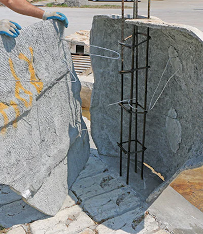 A rebar column is part of the kit. 5-foot wall sections are wired to the rebar frame that becomes the back of the cave. Columns should be strapped and braced before filling.