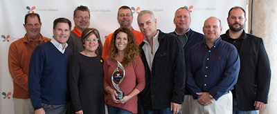 Center: Michelle and Ian Milligan, owners, La Costa Pool and Spa with Watkins executive and management team members and La Costa Pool and Spa staff.