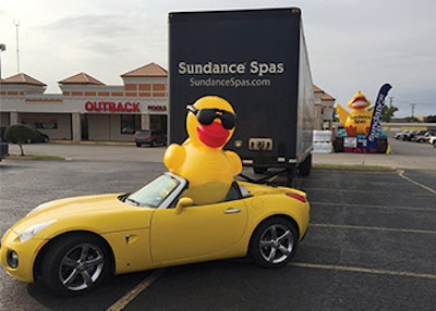 To attract onlookers to the truckload sale, Buckingham displayed a few oversized items, including a bright yellow convertible, a Sundance Spas semi truck and a large inflatable, pictured in the back on the right.