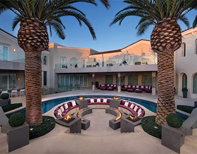 Fire features, elaborate landscape lighting, outdoor A/V systems, custom patio furnishing, which we used to introduce purple as a contrast, were used to create a sense of fun, luxury and interest.