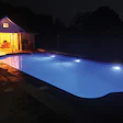 Simple replacement of incandescent or halogen lights with LEDs can transform a pool's nighttime appearance. This LED-lit pool has no large dark zones in the pool, just a warm, bright luminescence throughout.