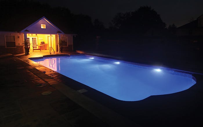 Simple replacement of incandescent or halogen lights with LEDs can transform a pool's nighttime appearance. This LED-lit pool has no large dark zones in the pool, just a warm, bright luminescence throughout.