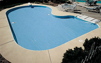 Lock-in-place solid winter covers have become a popular option for homeowners looking for clean aesthetics at a relatively affordable price point.