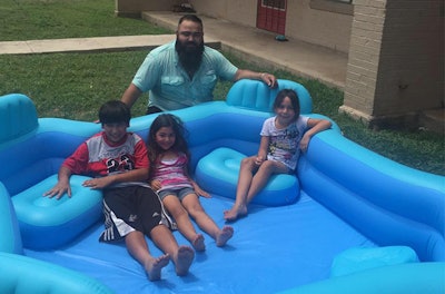 Todd Arredondo and a few happy, new pool owners. (Photo via Facebook)