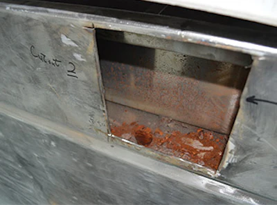 The forensic work we did involved removing the entire tile surface to reveal the damage below, as seen in this forensic photo.