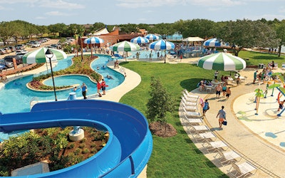The First Colony Community Association Aquatic Center in Sugar Land, Texas, one of many large-scale aquatic facilities and water parks designed by Water Technologies. This comparatively modest project features a zero-depth-entry pool, a lazy river, waterslides, a vortex pool and a separate spray pad.