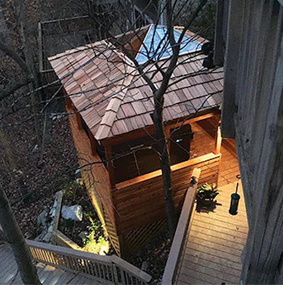 Made with Western cedar - for its weather-resistant qualities and sweet aroma - the gazebo features custom-made stained-glass panels on the ceiling and in the privacy screens.