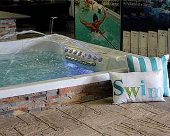 In addition to portable spas, AJ Spa carries a few swim spa models and the Covana spa cover system.