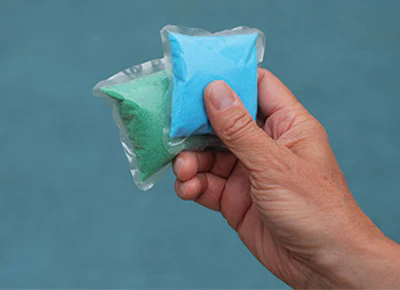 3. The homeowner/service tech adds the pods or chemicals to the pool.