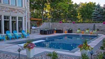 The award-winning project replaced the old pool and added a retaining wall.