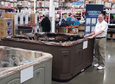 Spa Express employee Michael Ketchum is ready for a day of sales at Costco.