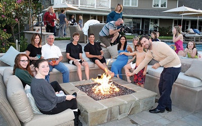 Fire pits are often the hub of social gatherings, as demonstrated by this inviting, contemporary-design pit and seating area, designed and installed by Scott Cohen. (Photo courtesy of The Green Scene Landscaping and Pools)