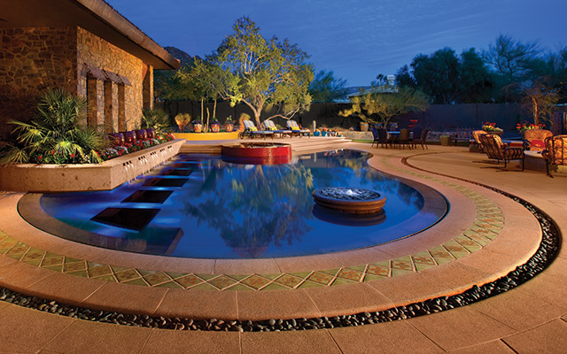 A mature ironwood tree was selected for its sculptural form, and serves as the reflected focal point enjoyed from all of the home's views. Primary colors were woven in to elicit a higher energy vibe, in keeping with the client's request for 'hacienda modern.' (All photos courtesy of Michael Woodall)