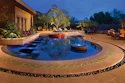 A mature ironwood tree was selected for its sculptural form, and serves as the reflected focal point enjoyed from all of the home's views. Primary colors were woven in to elicit a higher energy vibe, in keeping with the client's request for 'hacienda modern.' (All photos courtesy of Michael Woodall)