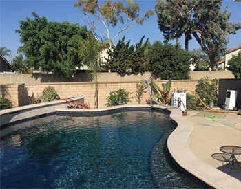 Leaky pool plumbing under this water cannon was renewed using a blown-through epoxy process instead of jackhammering.