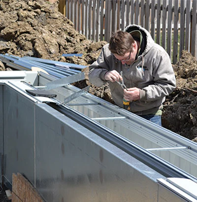 Needle nose pliers complete some fine detail on this pre-pour installation by Hillside Pools. (Photo courtesy of Hillside Pools)