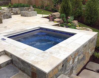 Custom spas are often designed and installed in conjunction with water features or fire features that dramatically enhance the panache of the spas and their surroundings. (Photo courtesy of Bradford Products)