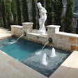 Spools or cocktail pools may be small, but they often include artistic touches and luxury features, as is the case with this spool from Carnahan’s Landscaping and Pools in Houston.