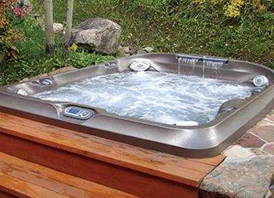 Traditional portable spas can take on the custom look when paired with creative hardscape surrounds that help visually blend vessels with the setting. (Photo courtesy of Ajax Pool & Spa)
