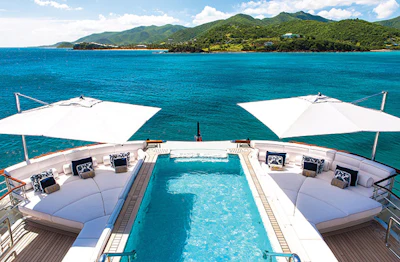 Whether it's cantilevered umbrellas on a luxury yacht or a retractable poolside canopy, designers and manufacturers alike draw inspiration from combining shade and water. (Photo courtesy of TUUCI)