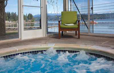 The indoor pool (top) and spa (above) offers both year-round comfort and breathtaking views of the Hood Canal and Olympic Mountains.
