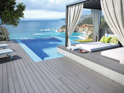 A benefit of composite decking: It won't be damaged from environmental elements like chemically treated pool water or salty ocean spray.