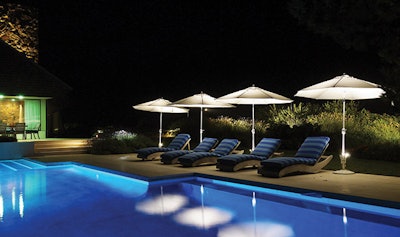 These unusual illuminated umbrellas proved a perfect solution for a client who wanted to light the pool deck and create attractive focal points in the landscape.