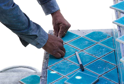 A tiled step adds more than just beauty and elegance to the pool. Properly installed with a layer of waterproofing, it provides durable protection for the concrete underneath.