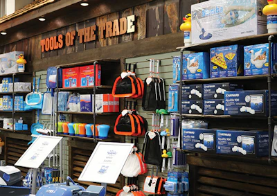 You can spot some barn tin under the shelves of the Tools of the Trade wall.