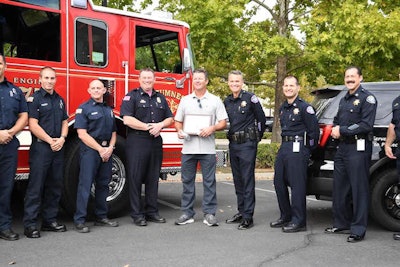 Jeff Garrett of Aquamatic Cover Systems is recognized by the Elk Grove Police Department for his act of bravery.
