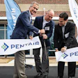 Pentair’s grand opening ribbon-cutters from left to right: John Stauch, president and CEO; Steven Risner, senior engineering director, Aquatic Systems; Phil Rolchigo, chief technology officer.