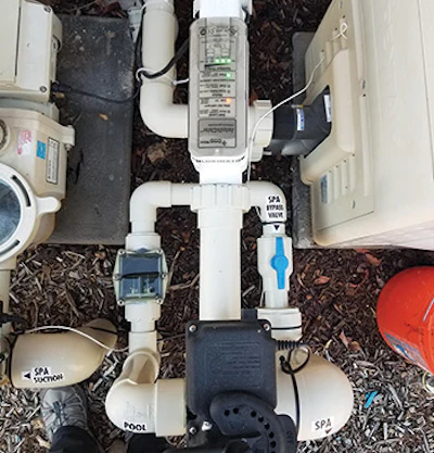 Older bypasses often use a diverter pipe, a check valve and a two-port valve from the pool return line to the spa return line, plumbed after the three-port valve to return water to the spa.