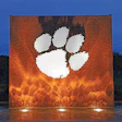 The new fountain at Clemson University uses shimmering glass tile and a white marble tiger paw to celebrate the school’s pride and community spirit.