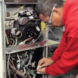 A student from Ranken’s microenterprise industry partnership program works on a heater.