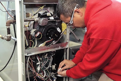 A student from Ranken’s microenterprise industry partnership program works on a heater.