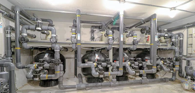 The equipment room located beneath the deep end serves the dual purpose of housing the equipment in a comfortable and accessible space while also serving as the pool's foundation in sandy soil conditions.