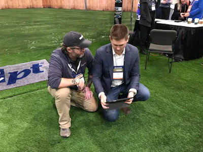 (From left to right) Dustin Hinton, IT Consultant and Client & Social Technologies Architect, gives a demo of the NPT Backyard App to AQUA Media Advisor Jared Fish.