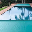 Perimeter overflow pool with a double auto cover installation; Photo courtesy of Automatic Pool Covers, Inc. Product installed by Poolsafe, Calif.
