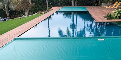 Perimeter overflow pool with a double auto cover installation; Photo courtesy of Automatic Pool Covers, Inc. Product installed by Poolsafe, Calif.