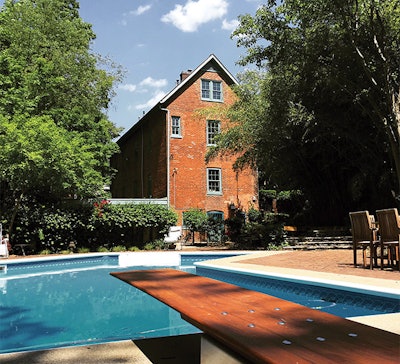 A beautiful diving board can act as an artistic accessory to the home, as well as a fun accessory to the pool. (Photo courtesy Wooden Diving Board Company)